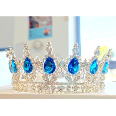 Large silver crown with blue gems