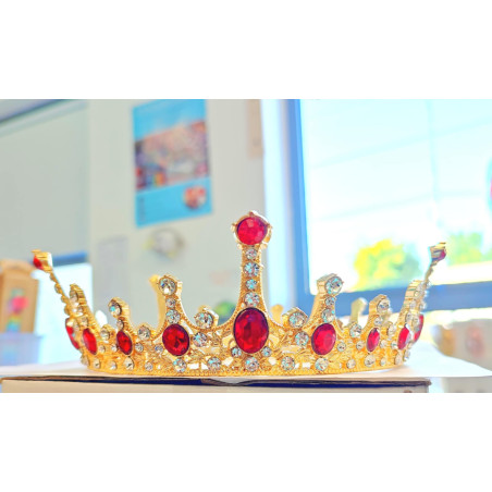 Large golden crown with multiple red gems