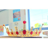 Large golden crown with multiple red gems