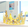 Tall golden crown with multiple colours gems
